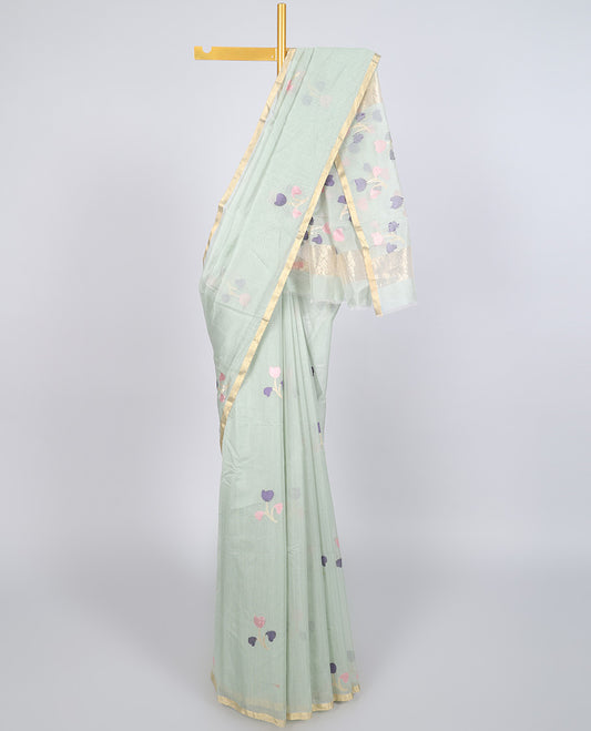 Pale green chanderi cotton saree with floral buttas, self-border & colorful floral design pallu