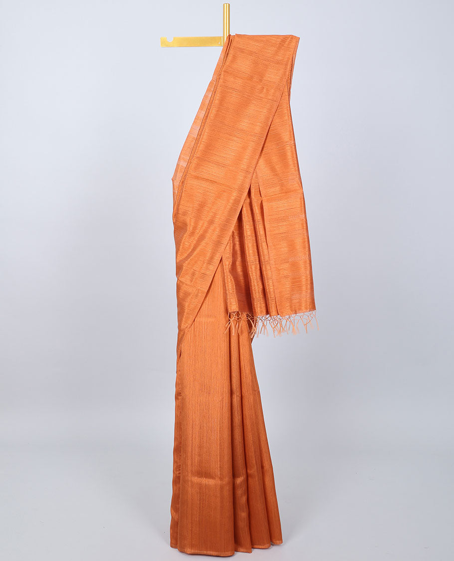 Borderless orange plain kamala silk saree, contrast floral motifs printed blouse 