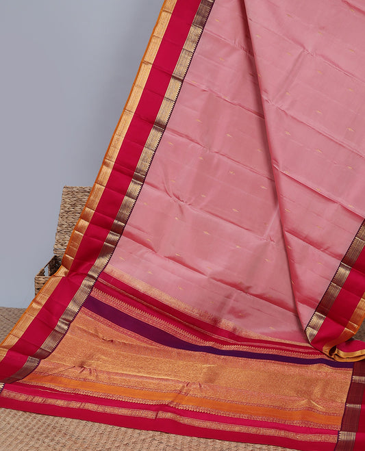 Pink silk saree with buttas, contrast rettai pettu border of rekku,muthu,banaras & kathir & zari-rich pallu