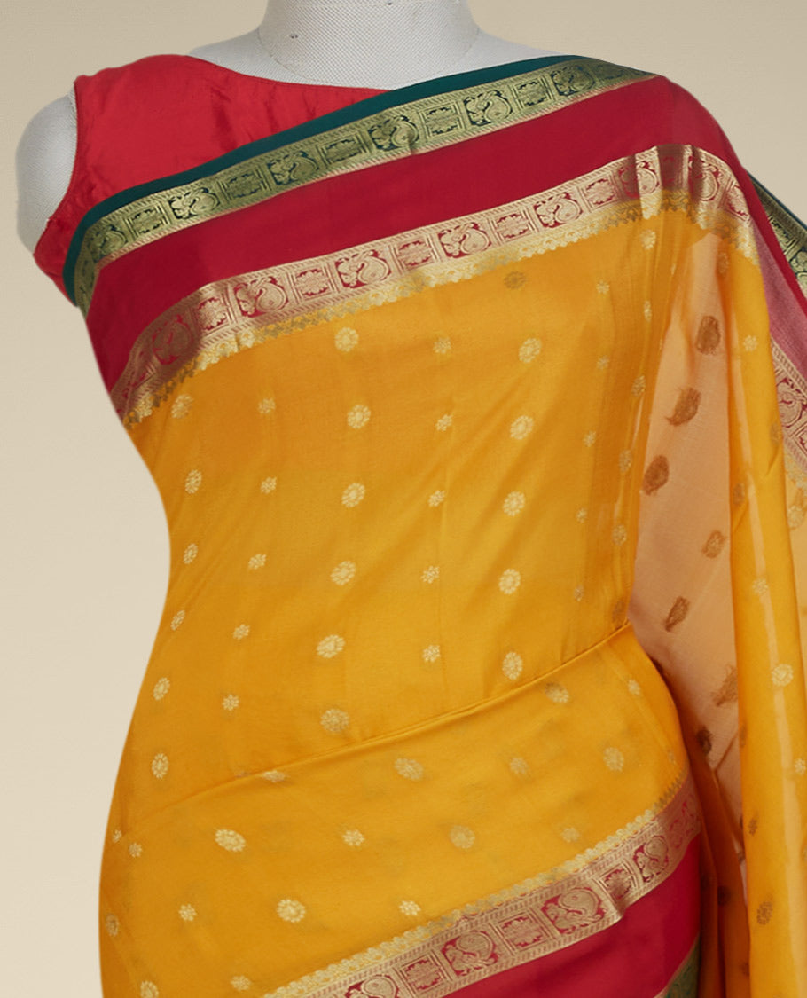 Orange mysore silksaree with zari buttas,contrast rettai pettu border of peacock & floral & pallu of jaal designs 