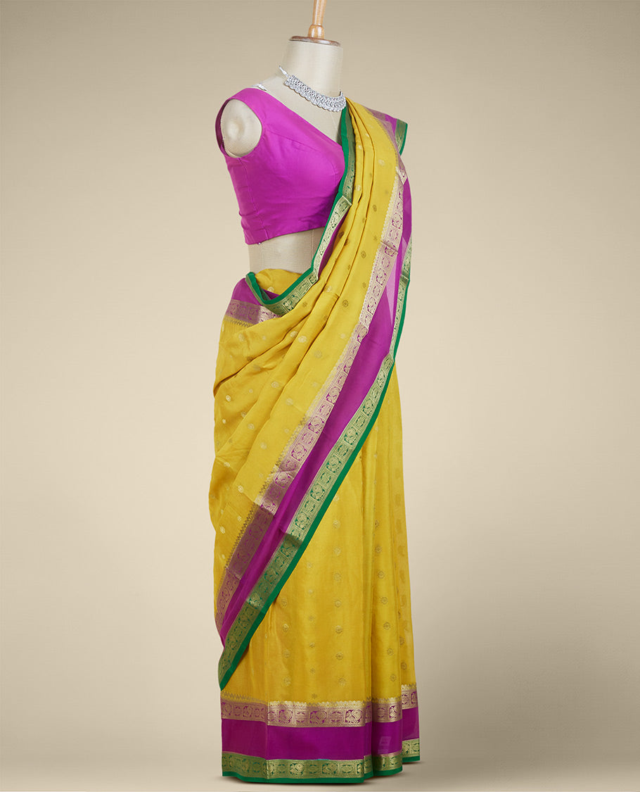 Yellow zari buttas mysore silk saree, contrast rettai pettu border of peacock & floral designs & pallu of jaal designs