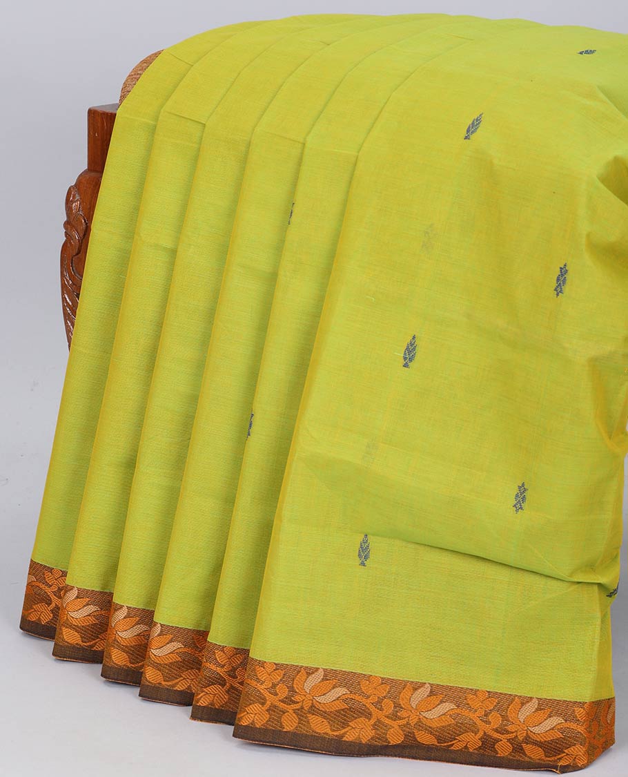 Green chettinad cotton saree with all-over buttas, contrast floral design border & pallu of stripes