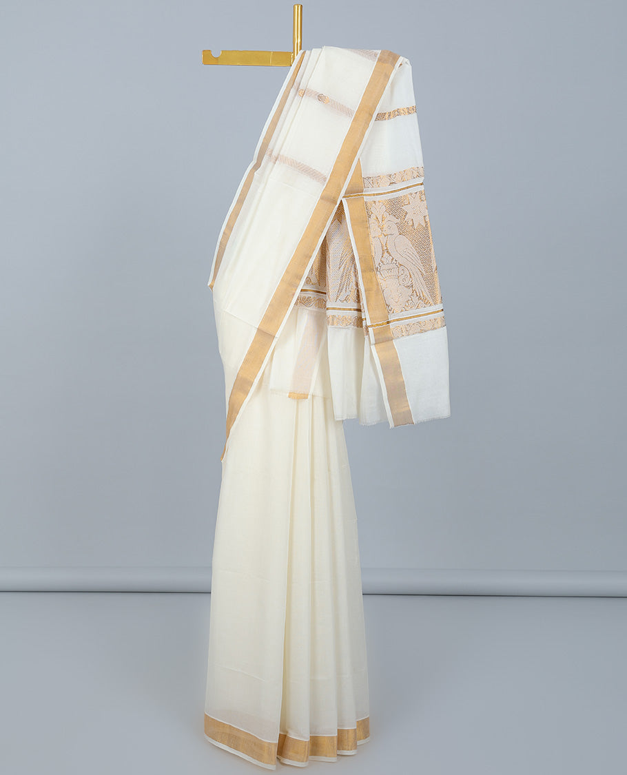 Cream kerala saree with zari designs, plain border & pallu of bird designs