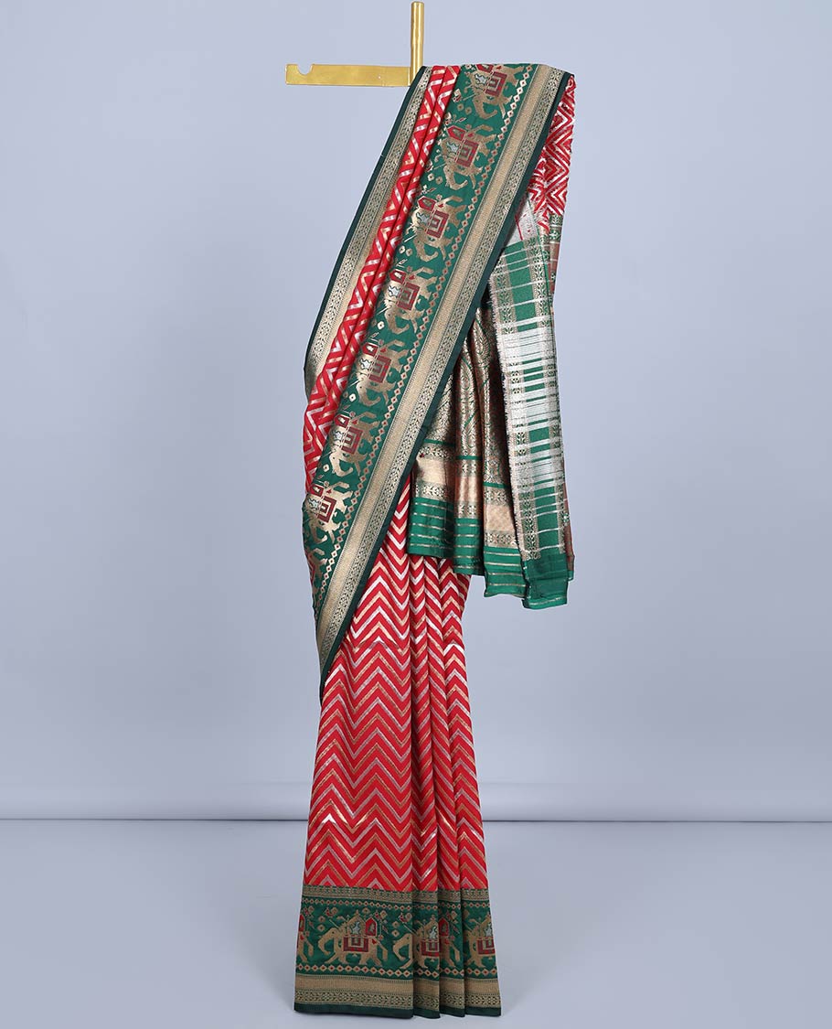 Red chevron jacquard semi-banaras jute saree, contrast patola-style border of elephant designs&pallu of intricate design