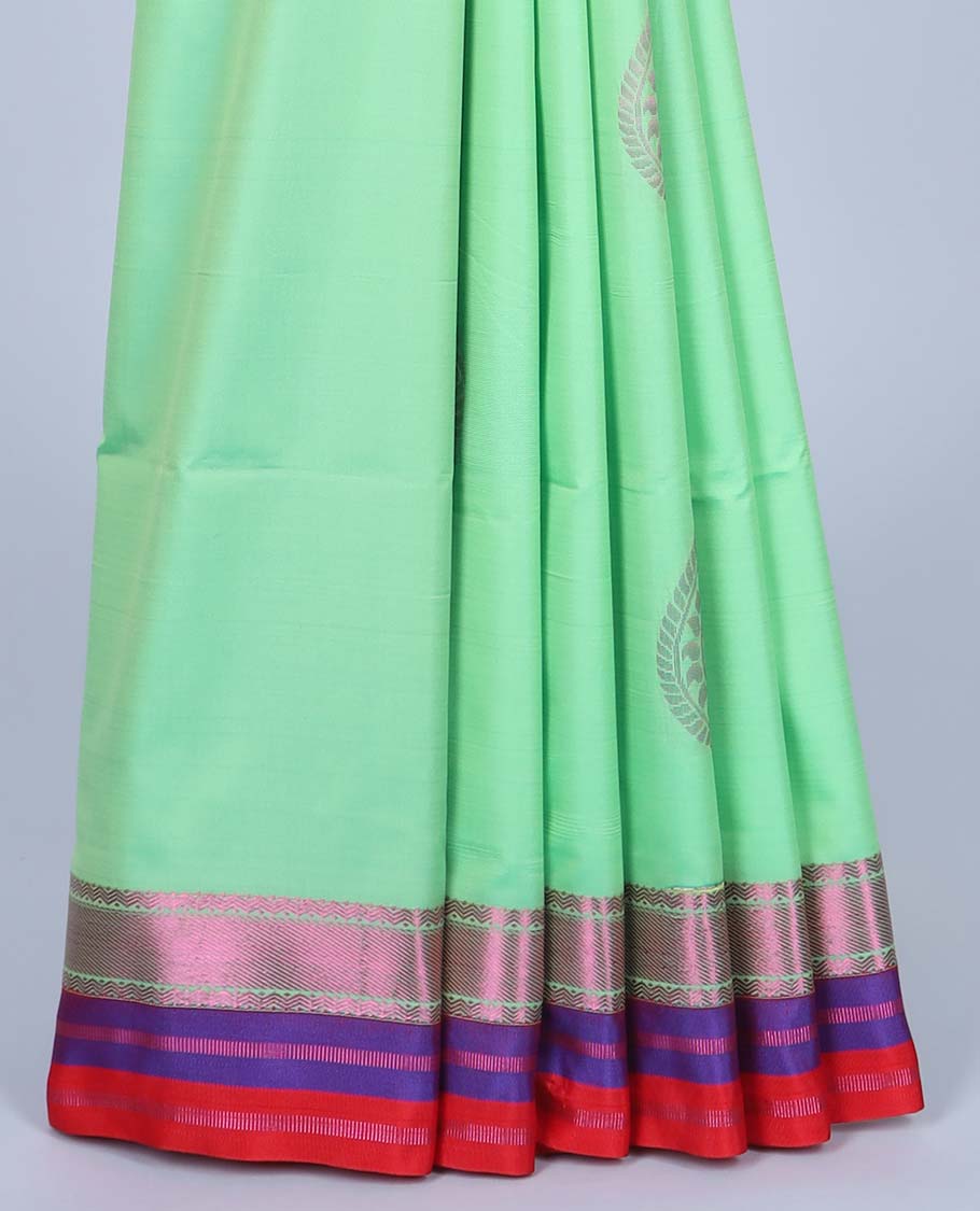Green semi-soft silk saree with zari buttas, contrast traditional design border & pallu of intricate designs