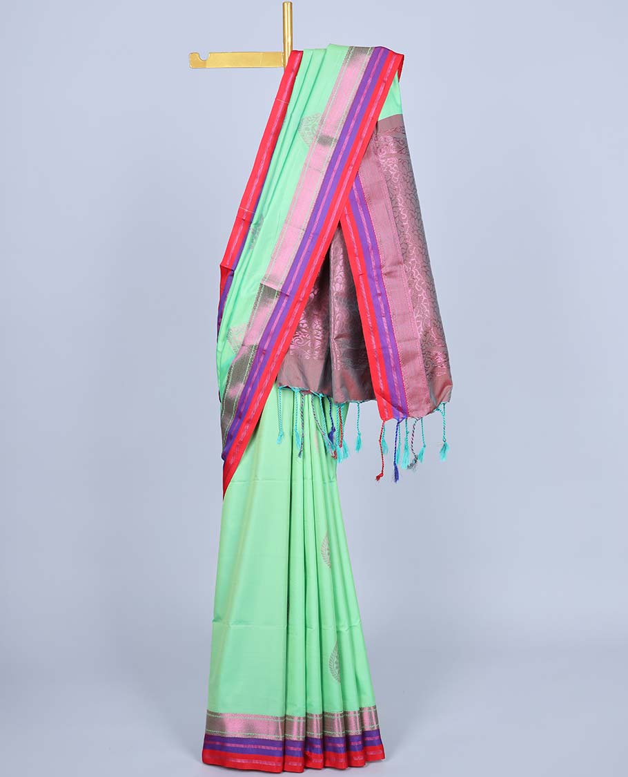 Green semi-soft silk saree with zari buttas, contrast traditional design border & pallu of intricate designs