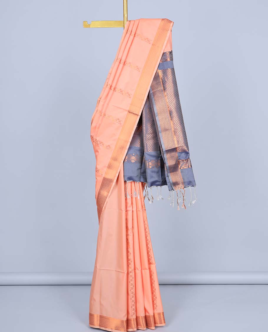 Peach semi-soft silk saree with zari buttas, ogee patterned border & contrast pallu of intricate designs