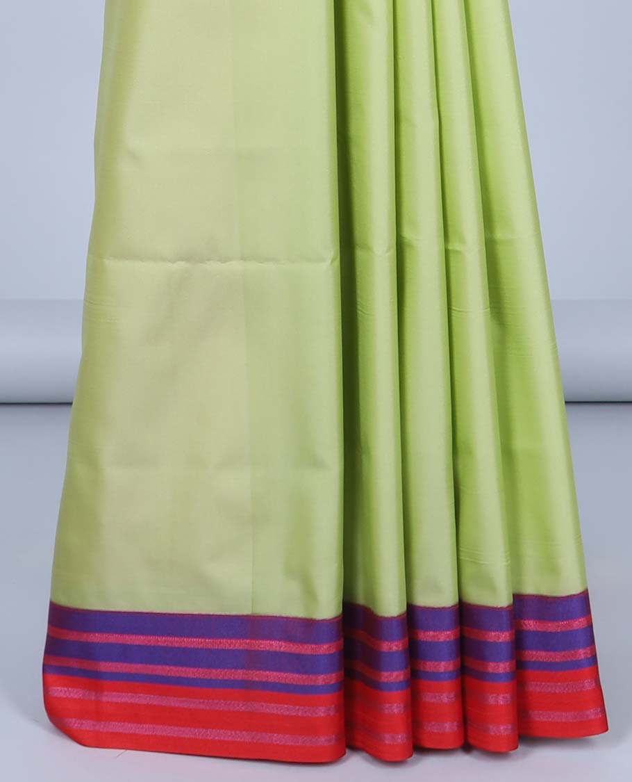 Green semi-soft silk saree with zari buttas, contrast striped border &  pallu of ogee patterns