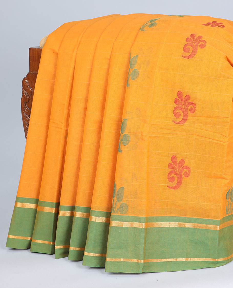 Orange kanchi cotton saree with buttas, contrast striped border & pallu of floral designs