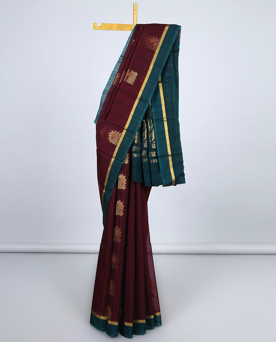 Maroon silk cotton saree with zari buttas, contrast plain border & pallu of floral zari designs