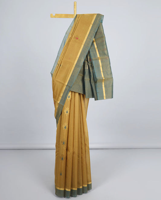 Mustard silk cotton saree with buttas, contrast plain border & pallu of chevron designs
