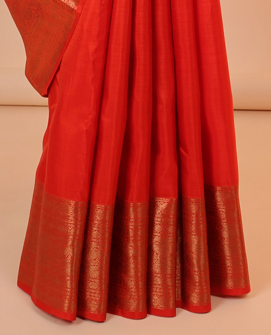 Orange buttas Kanchipuram silksaree, pallu flanked by iruthalai pakshi & border of kamalam,manga,iruthalai pakshi