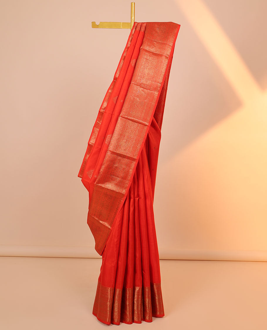Orange buttas Kanchipuram silksaree, pallu flanked by iruthalai pakshi & border of kamalam,manga,iruthalai pakshi