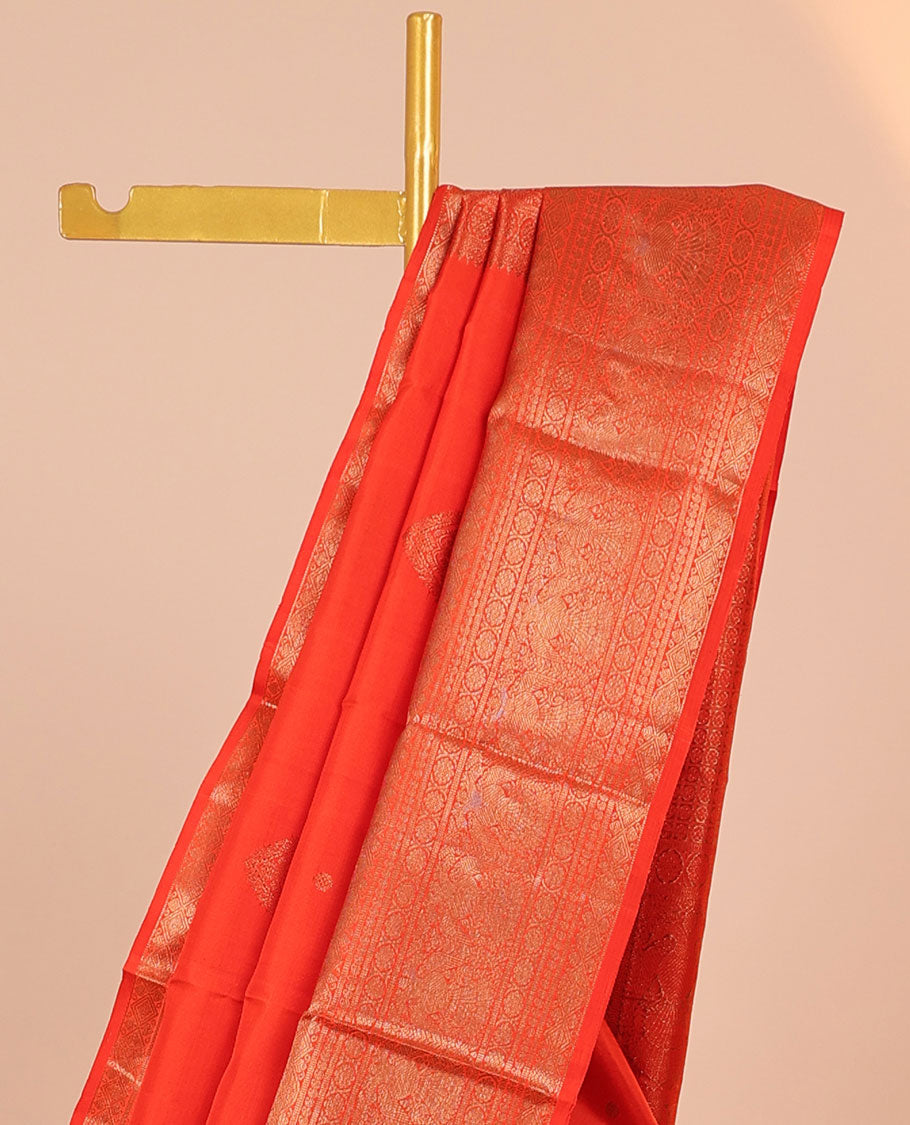 Orange buttas Kanchipuram silksaree, pallu flanked by iruthalai pakshi & border of kamalam,manga,iruthalai pakshi