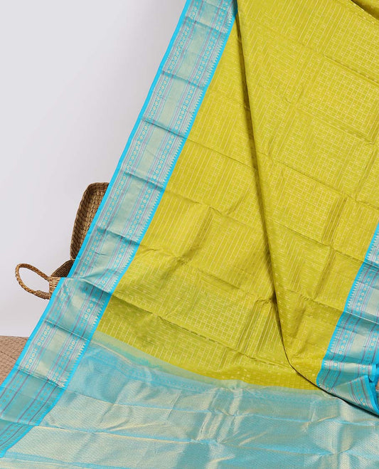 Green checked silksaree with zari buttas, contrast jaal pallu & border of rekku,muthu,banaras & kamalam