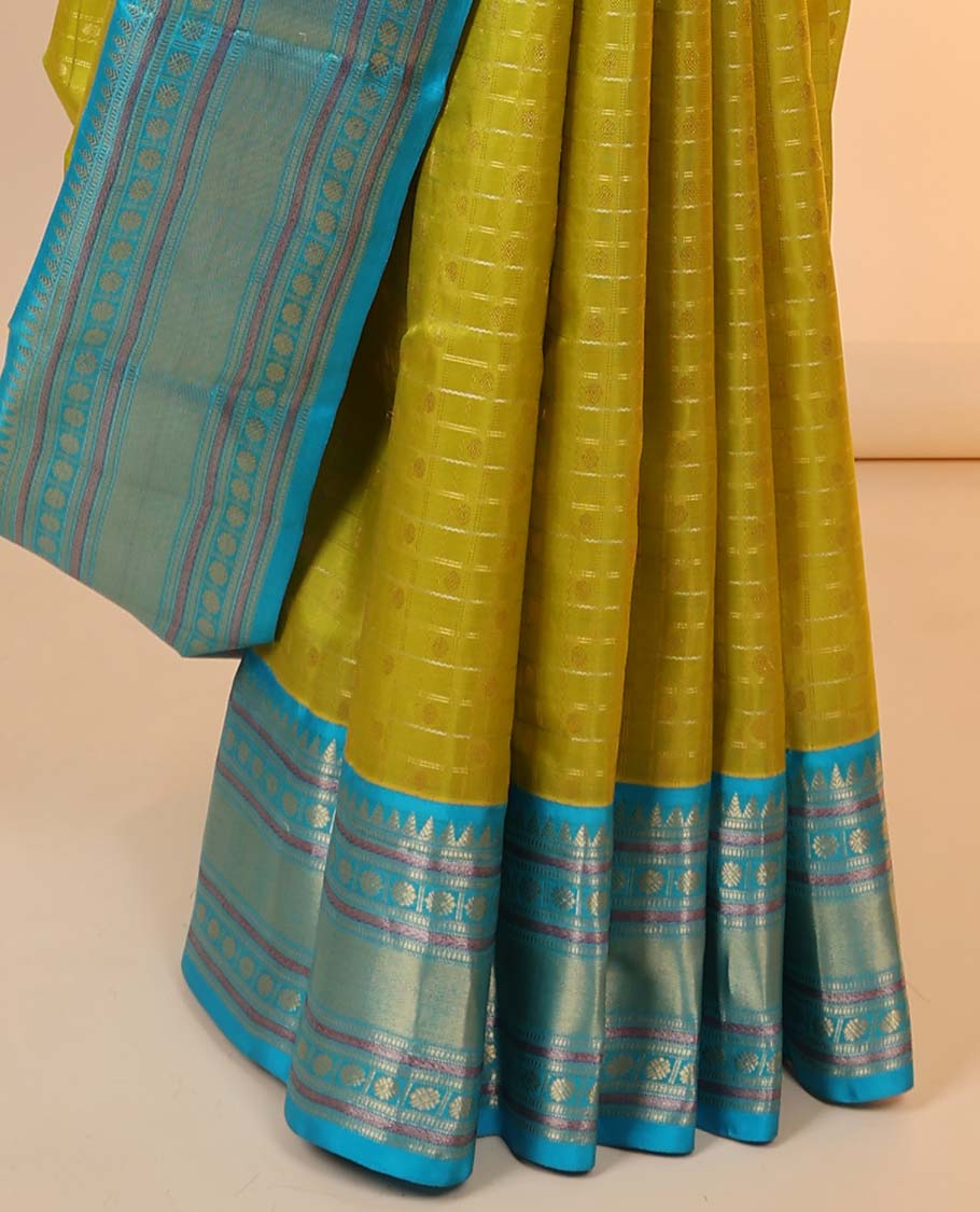 Green checked silksaree with zari buttas, contrast jaal pallu & border of rekku,muthu,banaras & kamalam