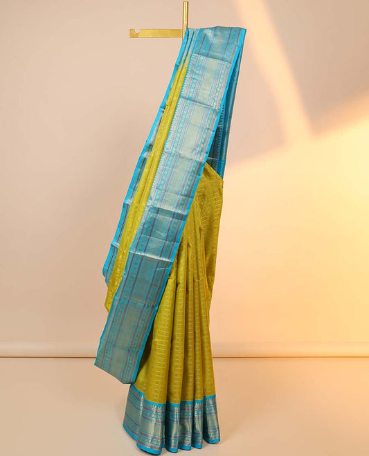 Green checked silksaree with zari buttas, contrast jaal pallu & border of rekku,muthu,banaras & kamalam