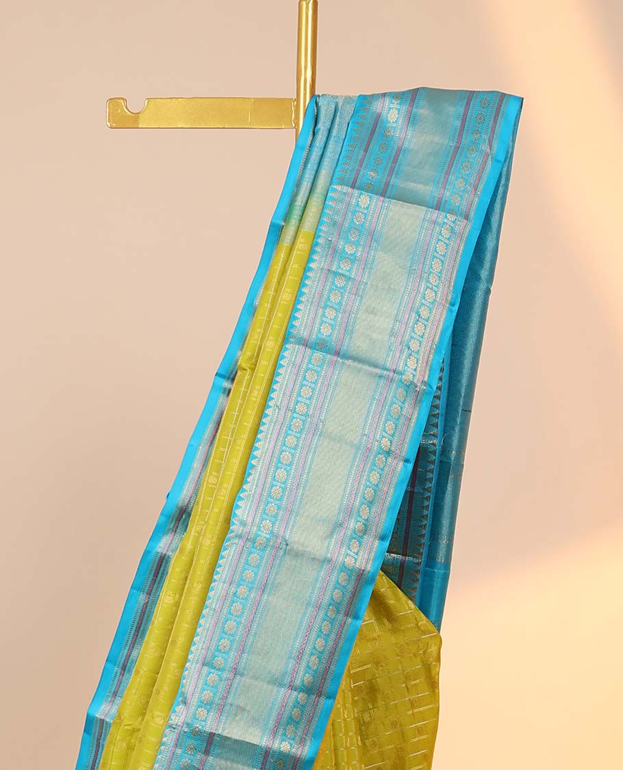Green checked silksaree with zari buttas, contrast jaal pallu & border of rekku,muthu,banaras & kamalam