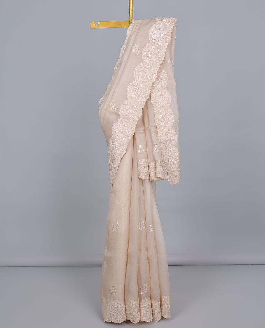Light sandal floral motifs embroidered organza saree, round floral embroidered scallop border & floral embroidered pallu