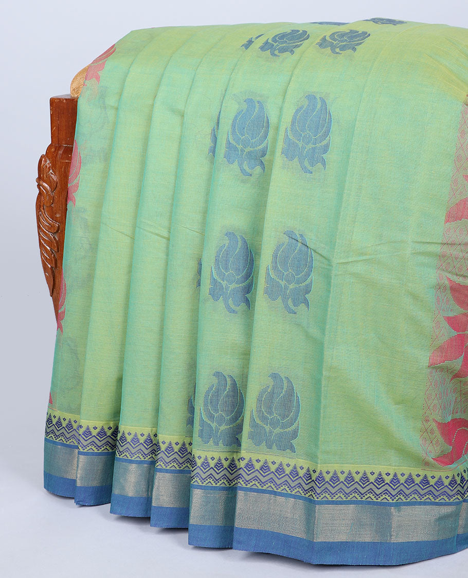 Green kanchi cotton saree with paisley buttas, contrast  temple border & pallu of floral designs