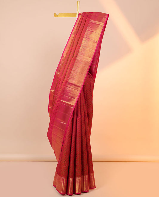 Orange embossed silksaree,contrast jaal design pallu & border of thilakam mokku,kathir,mayil & zari stripes