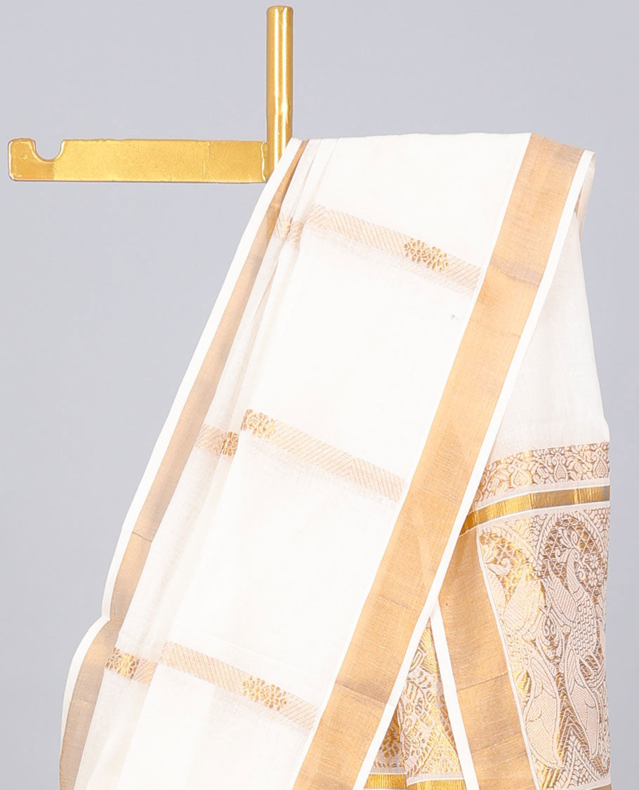 Cream kerala saree with zari stripes, zari border & pallu of peacock designs in zari