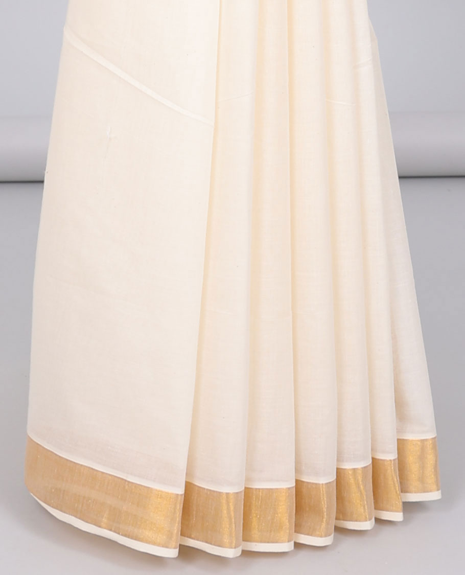 Cream kerala saree with zari stripes, zari border & pallu of floral designs in zari