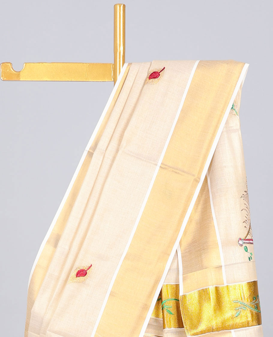 Gold leaf embroidered motifs kerala saree, zari border &  floral creeper & peacock feather embroidered pallu