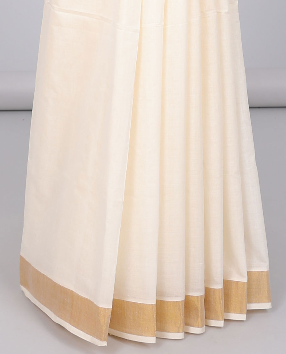 Cream kerala saree with zari designs, zari border & pallu of traditional designs in zari