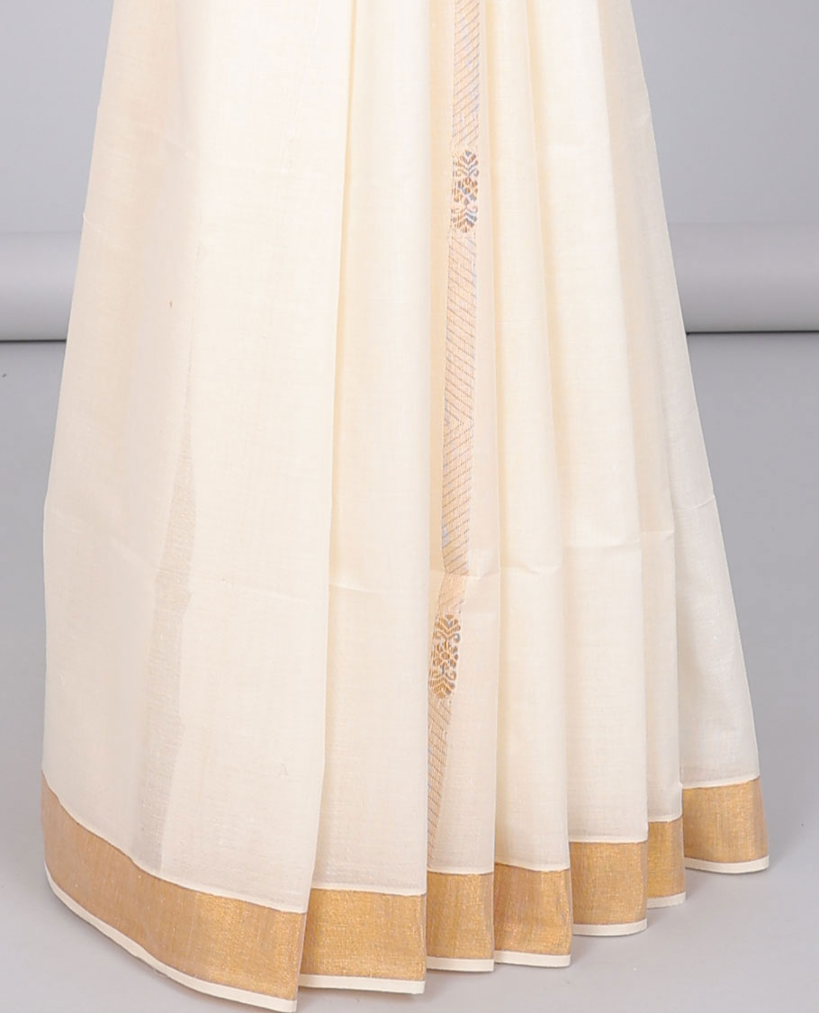 Cream kerala saree with zari designs, zari border & pallu of traditional designs in zari