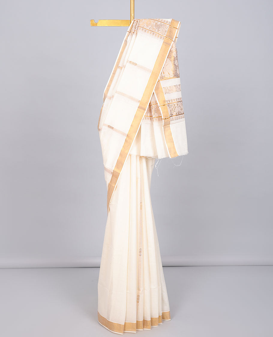 Cream kerala saree with zari designs, zari border & pallu of traditional designs in zari