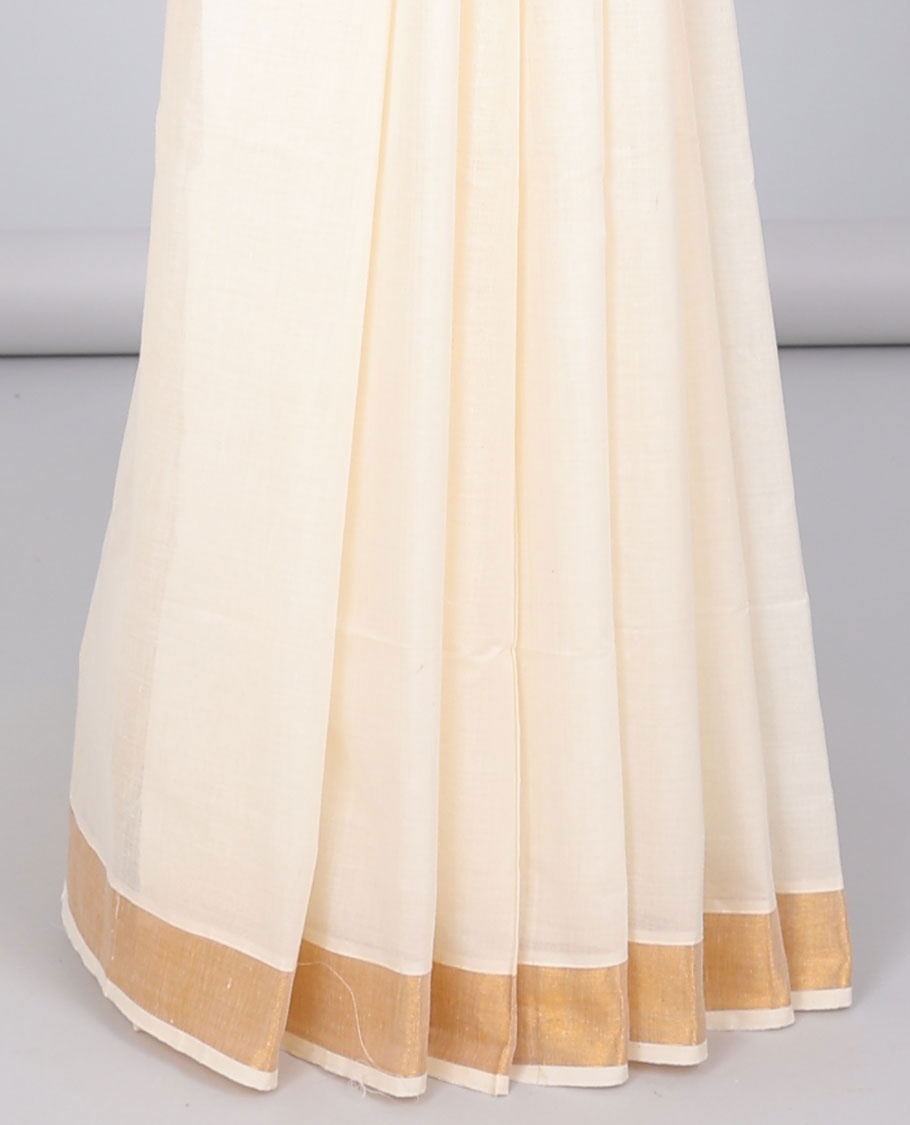 Cream kerala saree with zari designs, zari border & pallu of traditional designs in zari
