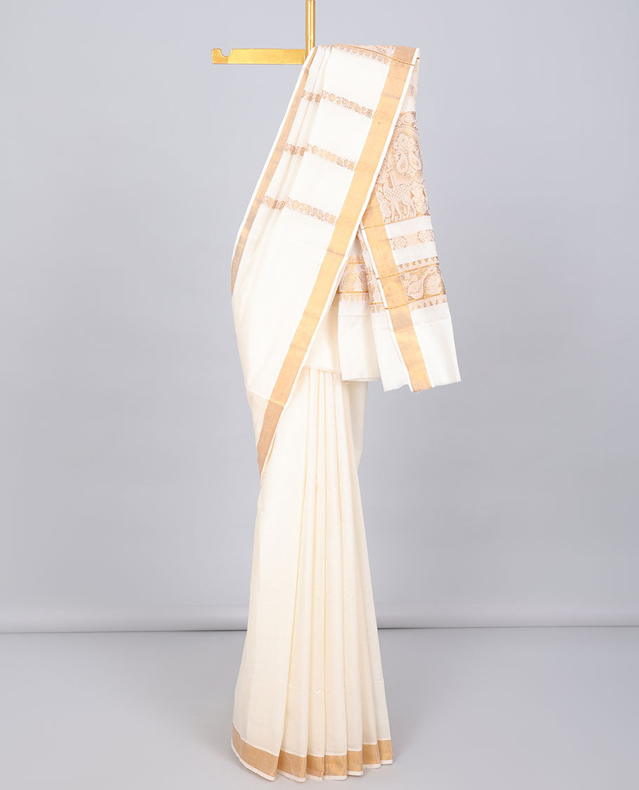 Cream kerala saree with zari designs, zari border & pallu of traditional designs in zari