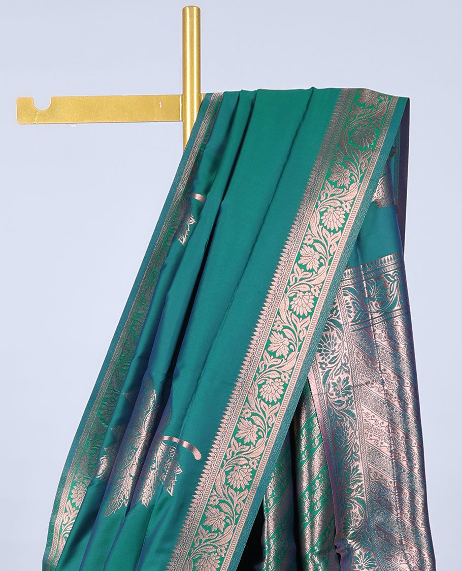 Green butter silk saree with zari buttas, floral creeper zari border & pallu of diagonal floral creeper design