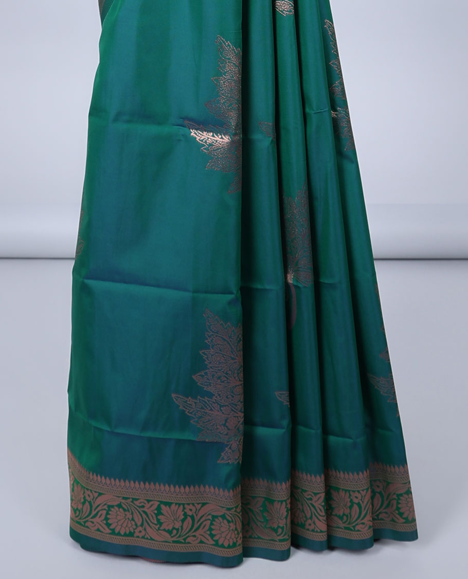 Green butter silk saree with zari buttas, floral creeper zari border & pallu of diagonal floral creeper design