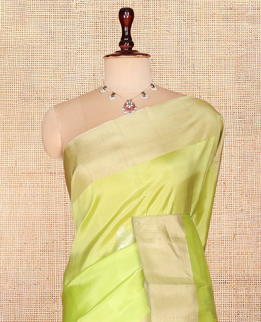 Green Semi Uppada Saree, Decked Up with Zari Buttas, a Bavanji Border, Contrast Intricate Pallu, and a Contrast Blouse