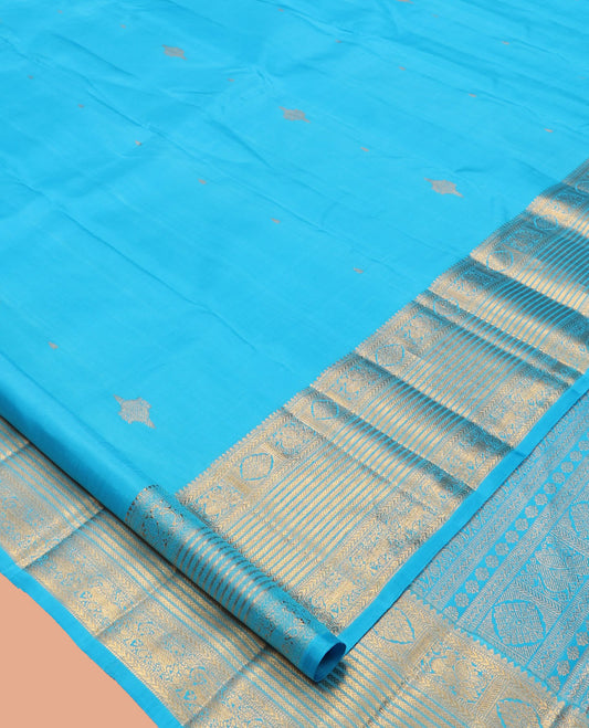 Blue Kanchipuram Silk Saree, Mesmerized with Zari Buttas, Highlighted by Zari Border of Thilakam Mokku, Kathir, Mayil, Chakram, and Yaali, Grand Pallu, and Matching Blouse