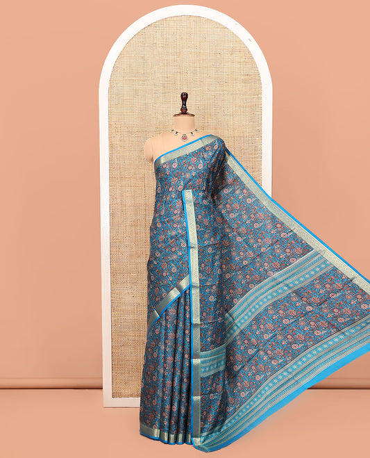 Blue Printed Silk Saree Features an Intricate Design, a Traditional Zari Border, an Intricate Pallu, and Matching Blouse