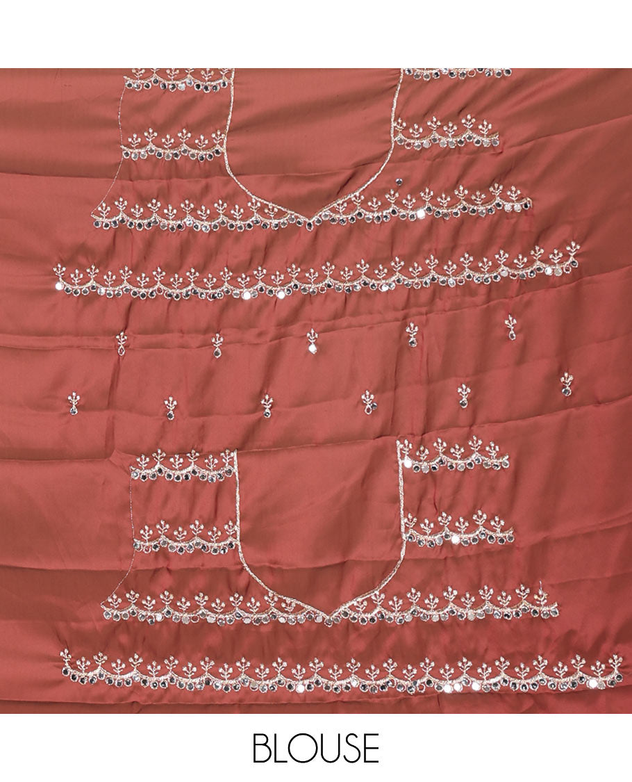 Orange floral motifs embroidered rangoli chiffon saree with mirror work border, embroidered pallu, and a contrast intricate scallop design embroidered blouse