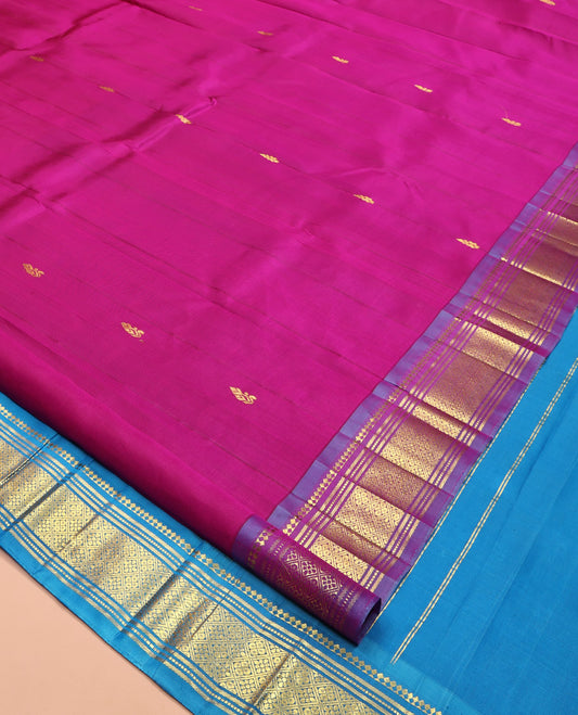 Pink Kanchipuram Silk Saree Featuring Zari Buttas, Complemented by a Contrast One-Sided Border of Panner Sombu, Banaras, Muthu, and Jaal Designs, Grand Pallu, and No Blouse