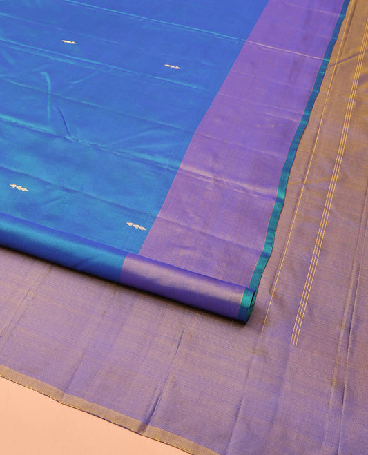Blue Kanchipuram Silk Saree, Highlighted by Zari Buttas All Over Its Body, Complemented by Contrast Border of Floral Designs, Pallu of Intricate Designs, and Paired with a Contrast Blouse