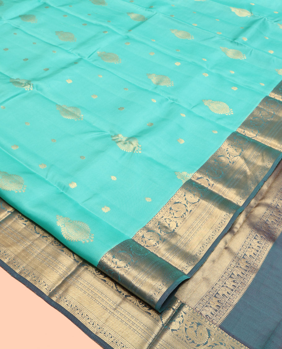 Turquoise Vasundhara Lite Silk Mix Saree, Detailed with Zari Buttas, Complemented by a Contrast Border of Kodi Mayil, Muthu, Mayil Kann, and Kodi Visiry, Jaal Pallu, and a Contrast Blouse