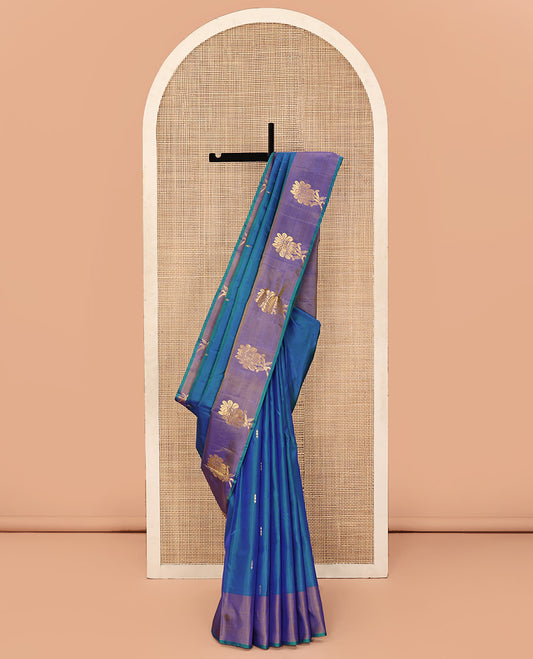 Blue Kanchipuram Silk Saree, Highlighted by Zari Buttas All Over Its Body, Complemented by Contrast Border of Floral Designs, Pallu of Intricate Designs, and Paired with a Contrast Blouse