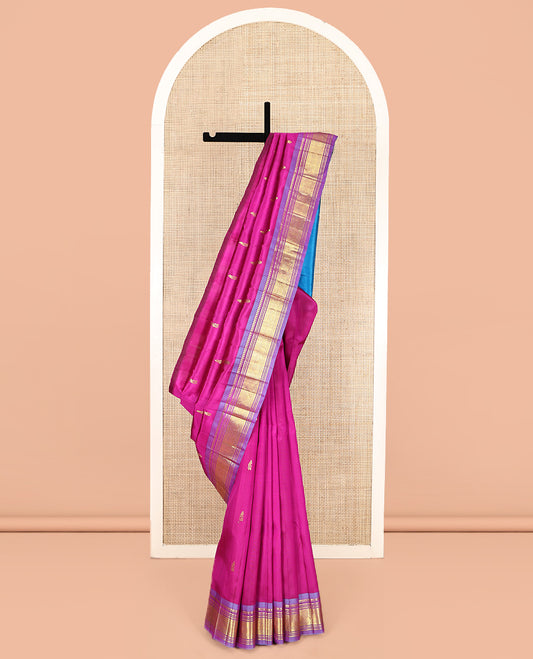 Pink Kanchipuram Silk Saree Featuring Zari Buttas, Complemented by a Contrast One-Sided Border of Panner Sombu, Banaras, Muthu, and Jaal Designs, Grand Pallu, and No Blouse
