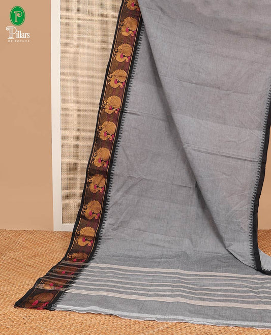 Grey chettinad cotton saree with temple, peacock design border & pathik print blouse