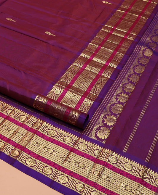 Purple Kanchipuram Silk Saree, Sparsely Woven with Zari Buttas on Its Body, Complemented by a Contrast One-Sided Border of Rekku, Laddu Kamalam, Kathir, and Jada Nagam Designs, Pallu Steeped with Laddu Kamalam Designs, and Comes Without a Blouse