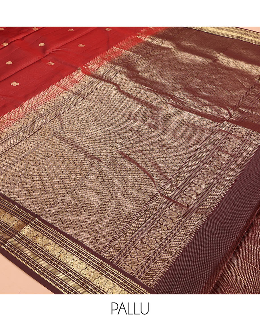 Crimson Red Vasundhara Silk Saree Featuring Vaira Oosi, and Annam Chakram Buttas, Complemented by a Contrast Border of Thilakam, Banaras, Mayil, Mayil Kann, Ara Bogudi, Muthu, and Banaras Designs, Grandly Woven Pallu, and a Contrast Blouse
