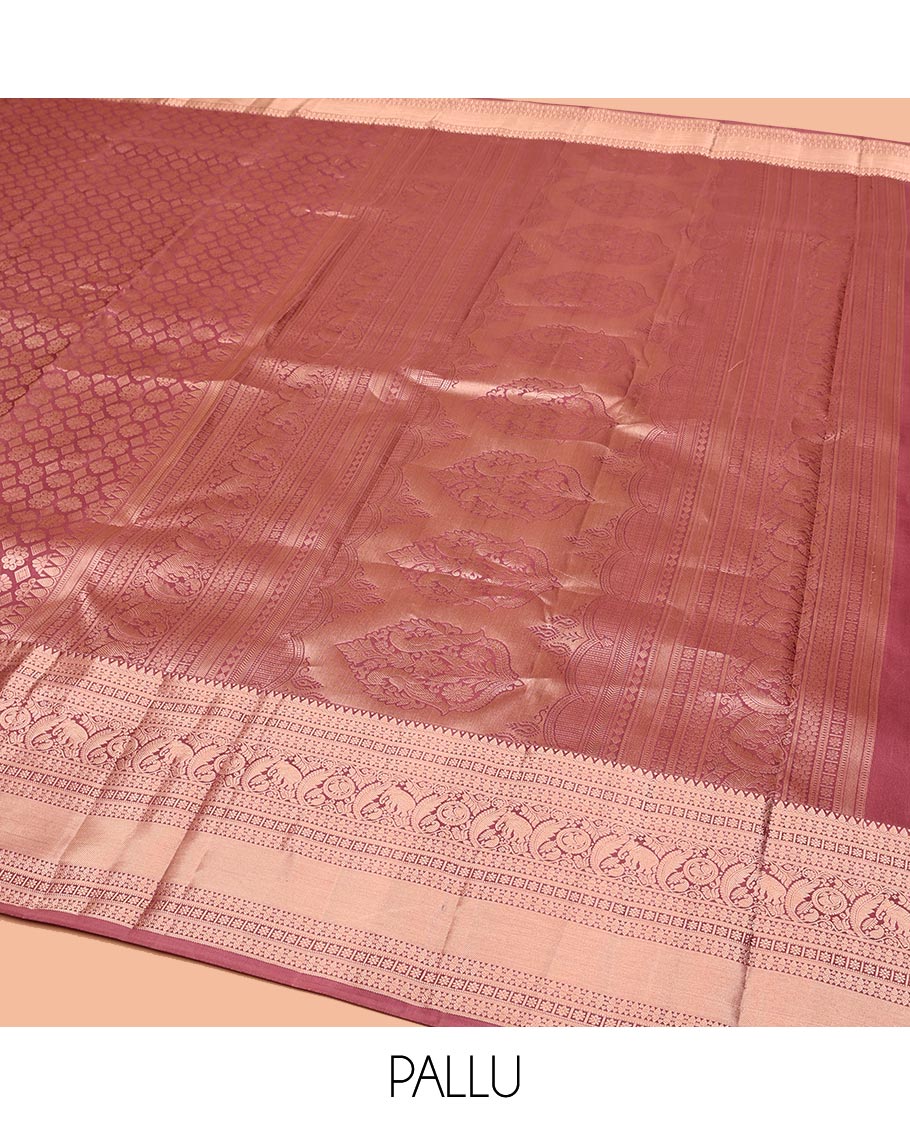 Rosewood Pink Kanchipuram Wedding Silk Saree, Artfully Detailed with Jacquard on Its Body, Highlighted by a Zari Border of Thilakam, Kamalam, Round Mayil, and Yaanai Designs, Opulently Embellished Pallu, and Paired with a Matching Blouse