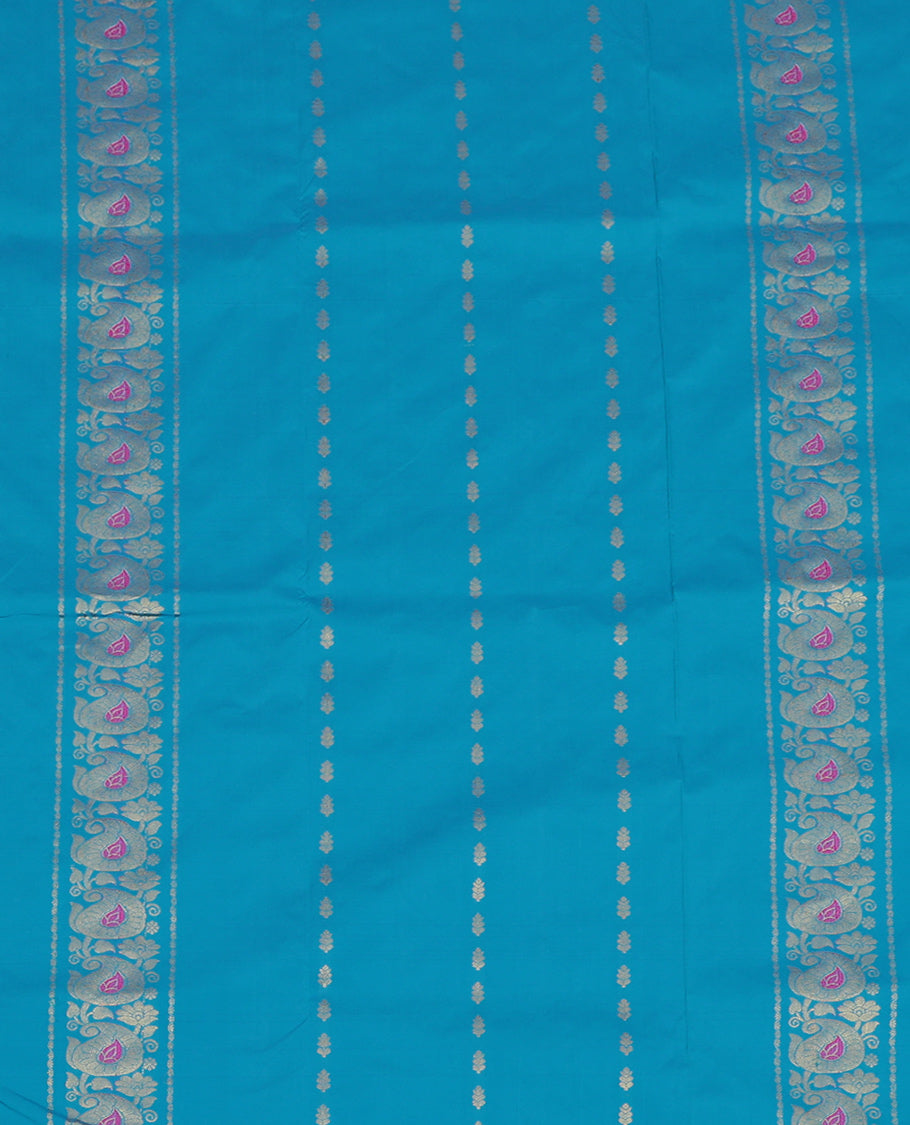 Blue Art Silk Pavadai Material Set, Delicately Woven with Zari Designs on Its Skirt, Complemented by a Contrast Paisley Zari Border, and a Matching Blouse