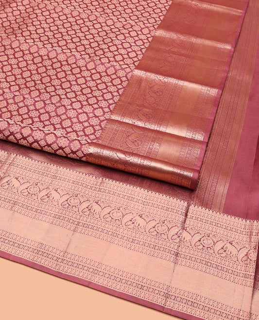 Rosewood Pink Kanchipuram Wedding Silk Saree, Artfully Detailed with Jacquard on Its Body, Highlighted by a Zari Border of Thilakam, Kamalam, Round Mayil, and Yaanai Designs, Opulently Embellished Pallu, and Paired with a Matching Blouse